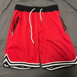 Red basketball gym shorts with zipper pockets L
